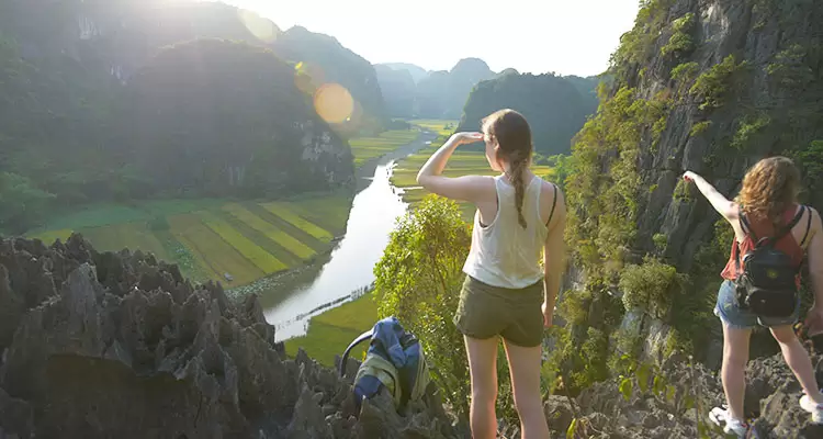 View of Ninh Binh with limestone cliffs and rice paddies