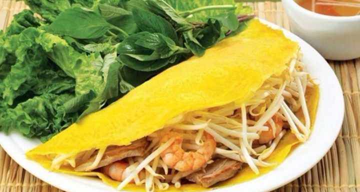 Crispy Banh Xeo, a savory Vietnamese crepe filled with shrimp, pork, and bean sprouts