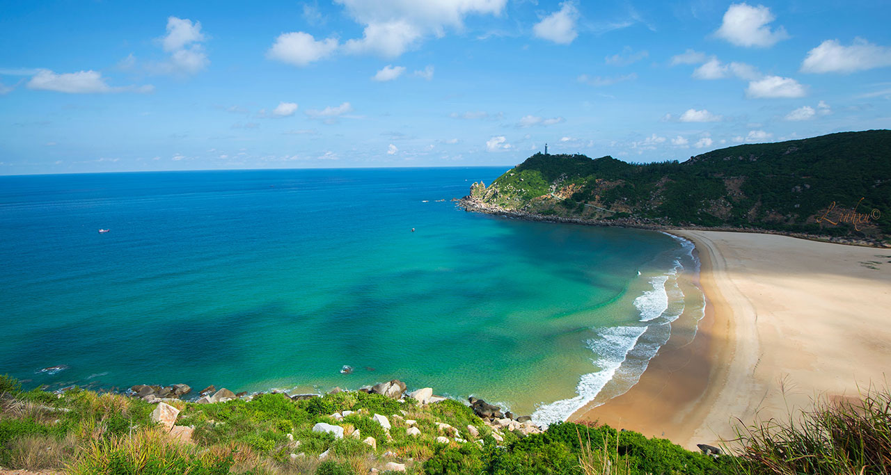 White sand, blue water and green hills at Phu Yen