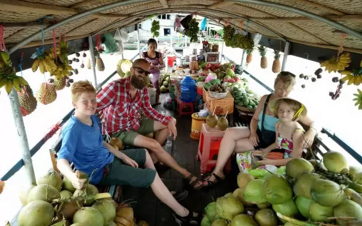 Tourist visit Tra On floating market on boat