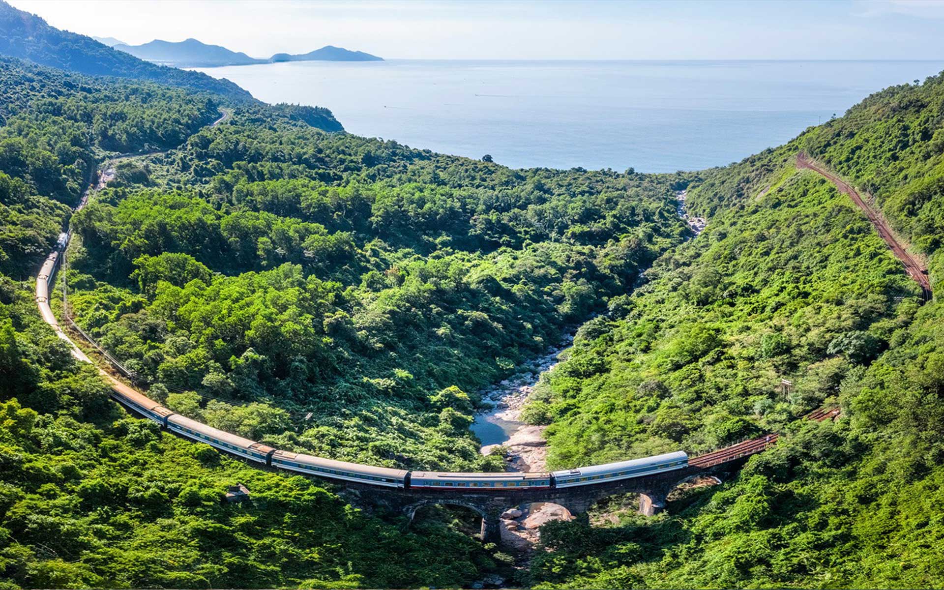 Scenic winding train journey over Hai Van Pass connecting Danang and Hue