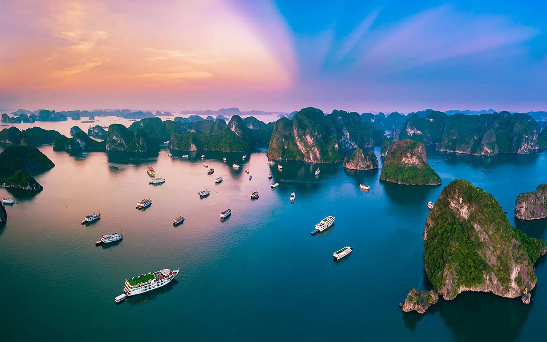 Aerial view of Ha Long Bay with limestone islands and blue water