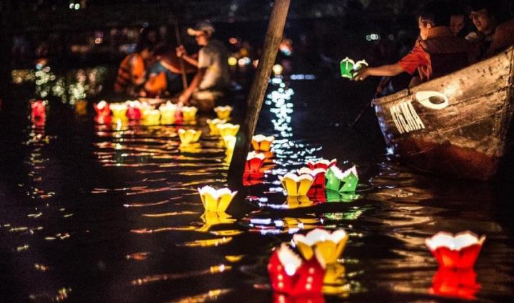 A mesmerizing display of colorful lanterns on the Thu Bon River during the Hoi An Lantern Festival in July.