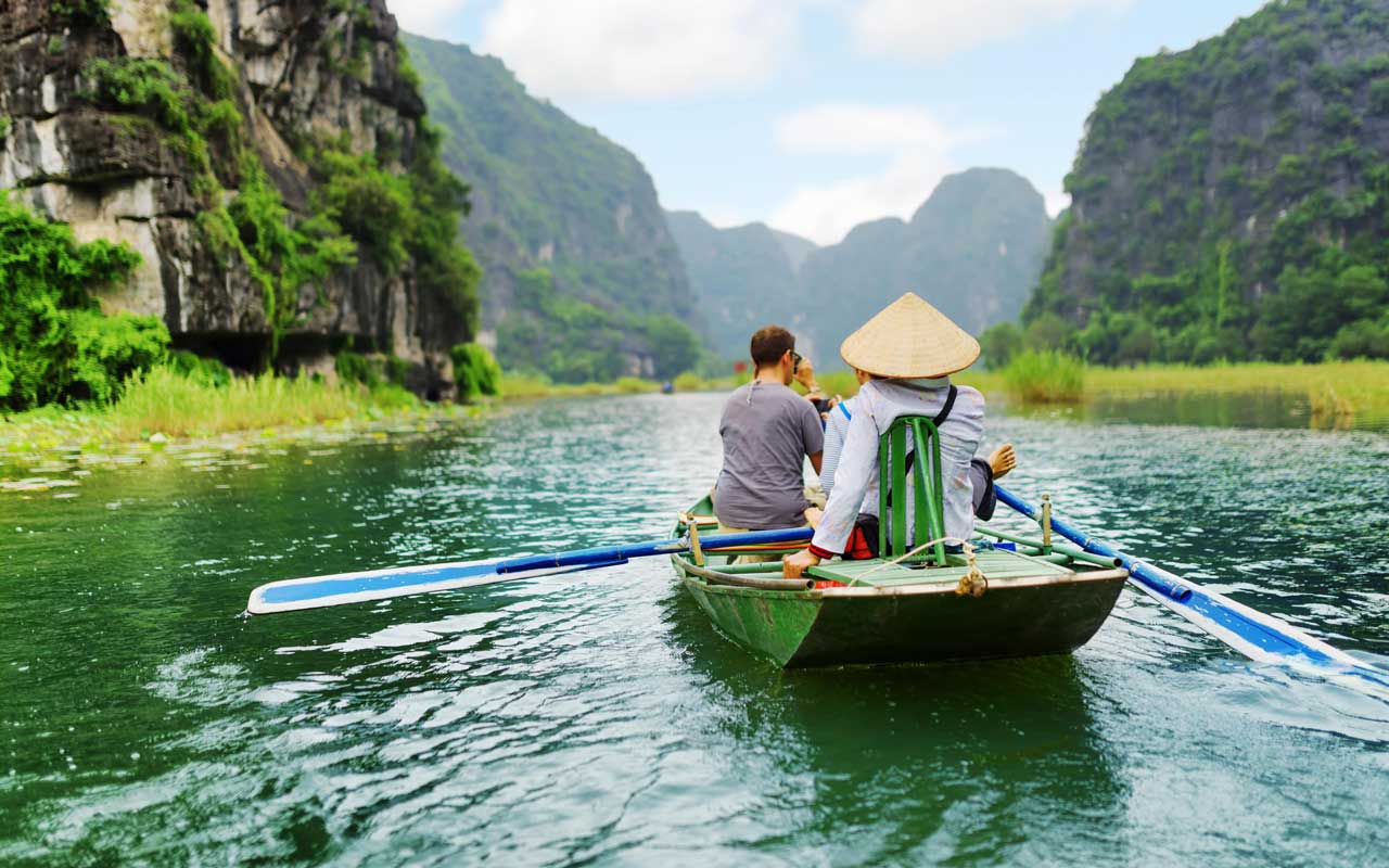A boat ride in Ninh Binh province in November with limestone karsts and rice fields