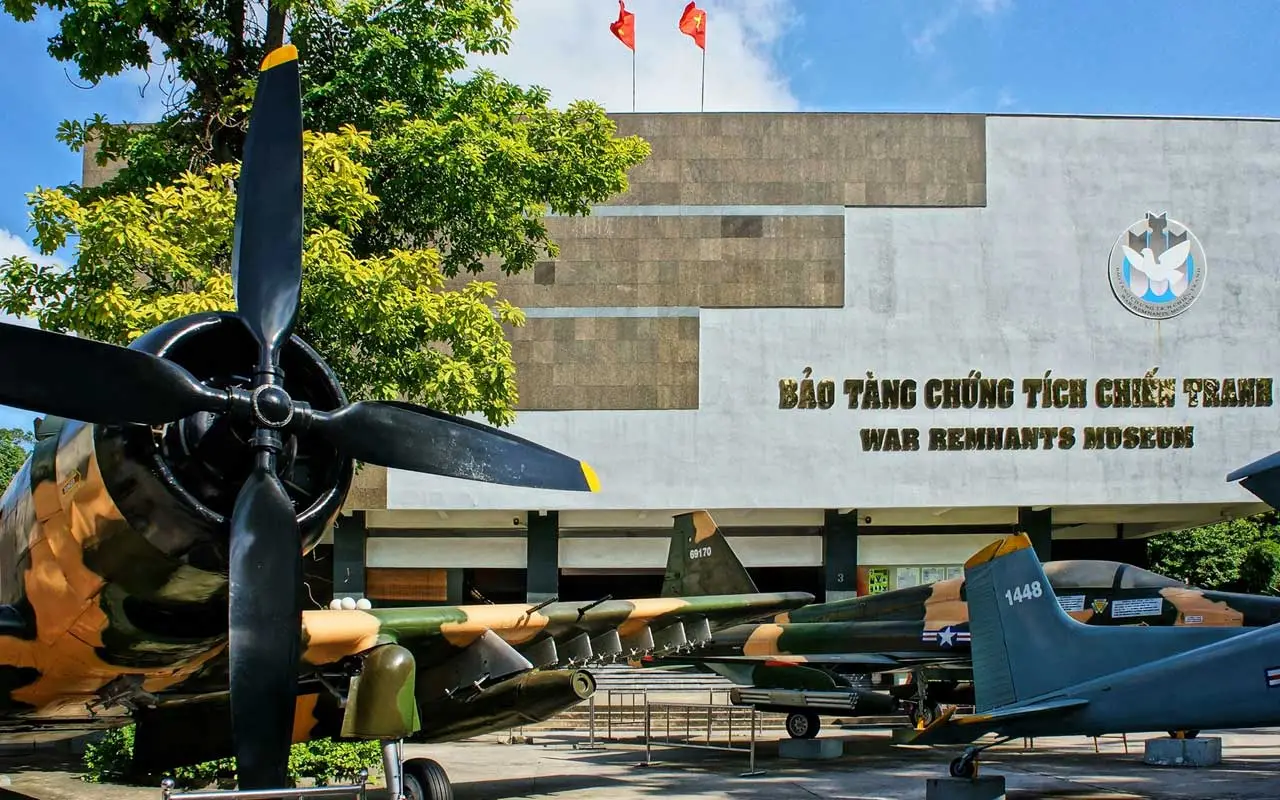 The entrance of the War Remnants Museum in Ho Chi Minh City with a sign and a plane