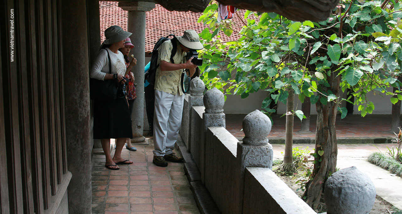 Visitor taking picture inside But Thap Pagoda