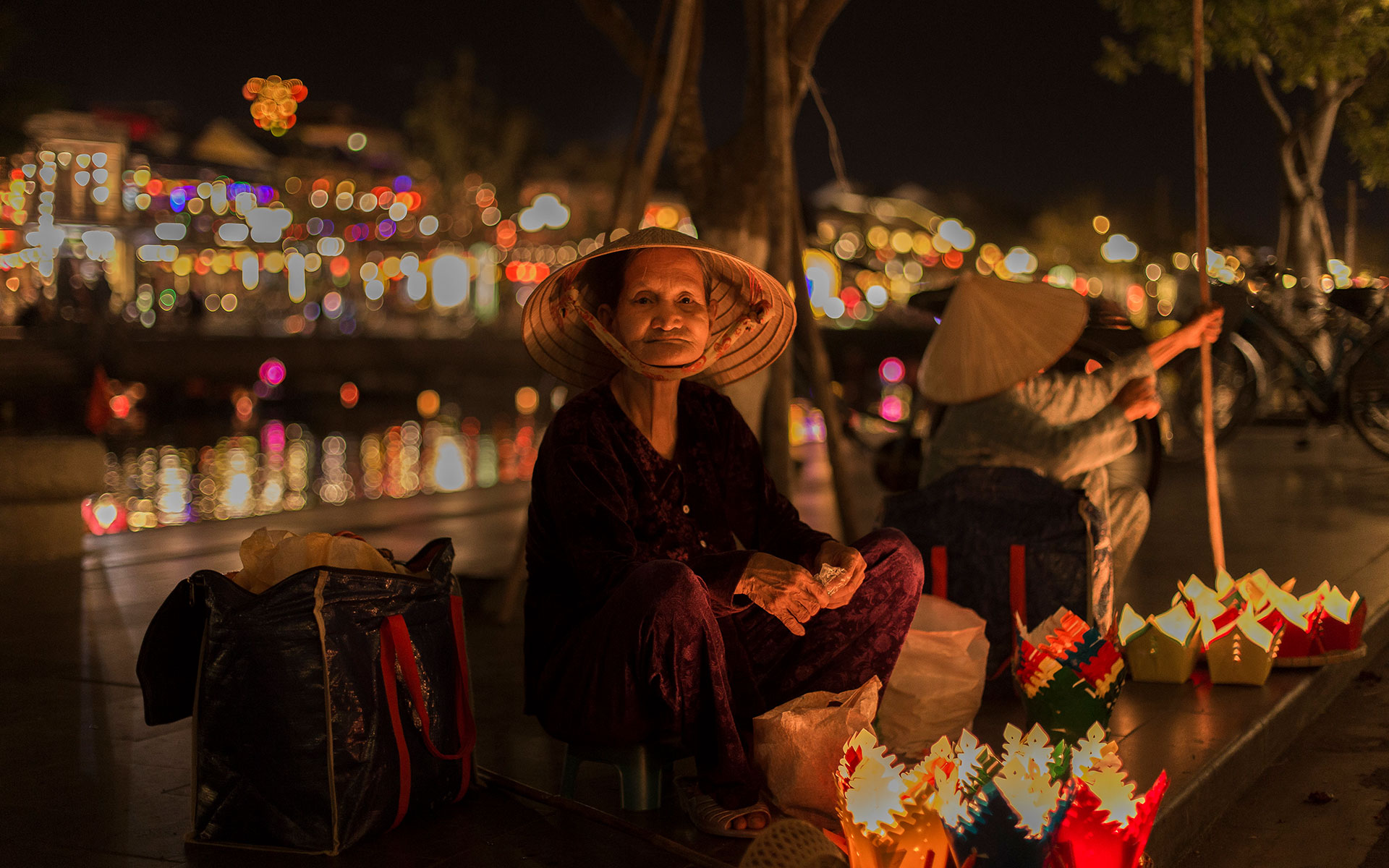  Buying a flower light to drop on Thu Bon River will be a highlight on your night market trip today.