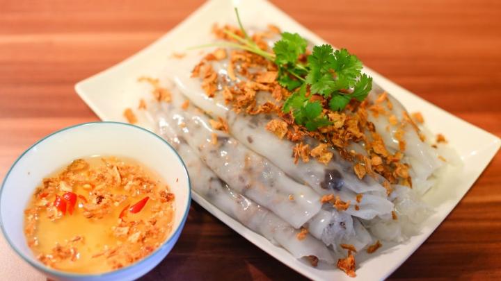 Bánh Cuon, Vietnamese steamed rice rolls, are a delightful comfort food enjoyed for their soft, translucent wrappers and savory fillings.