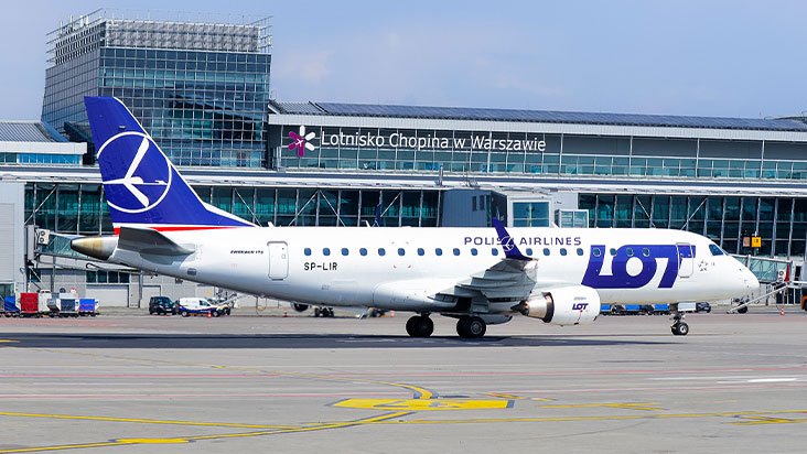 LOT Polish Airlines Embraer jet taxiing at Warsaw Chopin Airport
