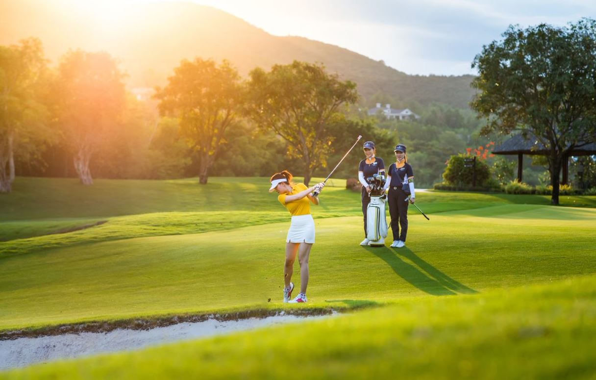 Golfer in proper golf attire playing from the fairway